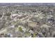 Aerial view showing the layout of the neighborhood with tree-lined streets at 1728 Timber Heights Dr, Carmel, IN 46280