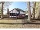 A charming backyard with a deck and bird feeders, providing a private outdoor retreat at 1728 Timber Heights Dr, Carmel, IN 46280
