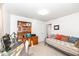 Bright bedroom featuring a daybed, workspace, and a charming wooden bookcase at 1728 Timber Heights Dr, Carmel, IN 46280