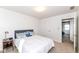 Bright bedroom featuring a doorway to another room and neutral carpet at 1728 Timber Heights Dr, Carmel, IN 46280