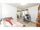 Bedroom featuring a daybed, mirrored closet, and a bright workspace at 1728 Timber Heights Dr, Carmel, IN 46280