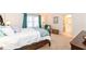 Light-filled bedroom with plush carpet, a cozy reading chair, and an ensuite bathroom at 1728 Timber Heights Dr, Carmel, IN 46280