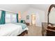 Bright bedroom features a cozy sitting area and ensuite bathroom access at 1728 Timber Heights Dr, Carmel, IN 46280