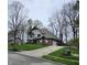 Charming brick home with a well-manicured lawn and mature trees, providing a welcoming curb appeal at 1728 Timber Heights Dr, Carmel, IN 46280