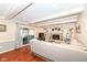 Living room boasts wood floors, a brick fireplace with built-ins, and sliding doors at 1728 Timber Heights Dr, Carmel, IN 46280