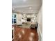Bright and airy living room with a fireplace, built-in shelves and hardwood floors, offering ample seating at 1728 Timber Heights Dr, Carmel, IN 46280