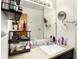 Bathroom with a sink and mirror with vanity lights at 230 N School St, Fortville, IN 46040
