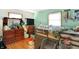 Bright bedroom showcasing a loft bed and hardwood flooring at 230 N School St, Fortville, IN 46040