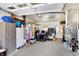 A large garage with storage, shelving, and a washing machine at 230 N School St, Fortville, IN 46040