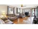 Comfortable living room featuring hardwood floors, neutral paint, and ample natural light at 230 N School St, Fortville, IN 46040