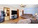 Cozy living room with hardwood floors leads into the kitchen area for seamless living at 230 N School St, Fortville, IN 46040