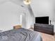 Cozy bedroom featuring a large bed, dresser with television, and carpet at 251 Hendricks Pl, Indianapolis, IN 46201