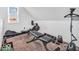 Well-equipped home exercise room with weight bench and rowing machine at 251 Hendricks Pl, Indianapolis, IN 46201