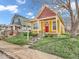 Charming home with a red door, a manicured lawn, and mature trees at 251 Hendricks Pl, Indianapolis, IN 46201