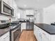 Modern kitchen features stainless steel appliances, granite countertops, and ample cabinet space at 251 Hendricks Pl, Indianapolis, IN 46201