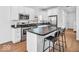 Modern kitchen featuring stainless steel appliances, white cabinets, and an island with seating at 251 Hendricks Pl, Indianapolis, IN 46201