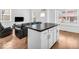 Open-concept living area with modern kitchen island and comfortable seating area at 251 Hendricks Pl, Indianapolis, IN 46201