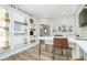 Designer showroom with a large table, samples of materials, and a view into the next room at 2777 Penn Ave, Plainfield, IN 46168