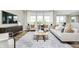 Bright, open living room with large windows, comfortable seating, and modern decor at 2777 Penn Ave, Plainfield, IN 46168