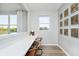 Bright study area with a built-in desk, modern decor, a view of the yard, and wood flooring at 2777 Penn Ave, Plainfield, IN 46168