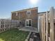 Enclosed backyard with a grass lawn and patio space, enclosed with a wood fence at 2826 Country Estates Dr, Indianapolis, IN 46227