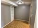 Finished basement area with a built-in shelving unit and parquet flooring at 2826 Country Estates Dr, Indianapolis, IN 46227