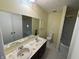 Bright bathroom with double sinks, a large mirror, and a shower-tub combo at 2826 Country Estates Dr, Indianapolis, IN 46227