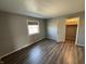 Bedroom features wood floors, neutral paint, and a large window for natural light at 2826 Country Estates Dr, Indianapolis, IN 46227
