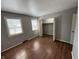 This bedroom features hardwood floors, a large closet, and two windows for natural light at 2826 Country Estates Dr, Indianapolis, IN 46227