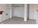 A clean basement space featuring a closet with shelves, a white painted door, and neutral carpeting at 3300 Heritage Rd, Columbus, IN 47203