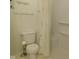 Bathroom with a white toilet and shower area with a curtain at 3300 Heritage Rd, Columbus, IN 47203