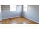 Bedroom featuring natural light, hardwood floors, and open shelving at 3300 Heritage Rd, Columbus, IN 47203