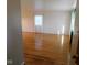 Bright living room with hardwood floors, fresh paint, and large window at 3300 Heritage Rd, Columbus, IN 47203
