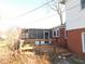 Cozy screened-in porch with wooden deck and access to the backyard at 3300 Heritage Rd, Columbus, IN 47203