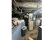 Utility basement featuring a furnace, laundry area, and exposed ductwork, needing some TLC at 340 N Eaton Ave, Indianapolis, IN 46219