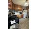 Traditional kitchen featuring wood cabinetry, standard appliances, and a functional layout ready for customization at 340 N Eaton Ave, Indianapolis, IN 46219