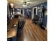 Eclectic living room with rich hardwood floors and blue walls with unique decor at 340 N Eaton Ave, Indianapolis, IN 46219