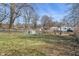 Large backyard featuring a mix of grass and natural growth at 3505 Ralston Ave, Indianapolis, IN 46218