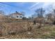 Backyard with chainlink fence and neighboring homes at 3505 Ralston Ave, Indianapolis, IN 46218