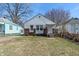 Charming single-Gathering home with white siding, brick accents, and a well-maintained front lawn at 3505 Ralston Ave, Indianapolis, IN 46218