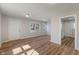 Spacious living room featuring wood floors and a large window for natural light at 3505 Ralston Ave, Indianapolis, IN 46218