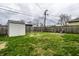 Large backyard with a storage shed, wood fence, and plenty of space for outdoor activities at 3867 Asbury St, Indianapolis, IN 46227