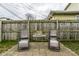 Patio area with outdoor seating, offering a relaxing space within a fenced backyard at 3867 Asbury St, Indianapolis, IN 46227