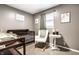 Neutral Bedroom featuring a crib, rocking chair, and a round side table on soft neutral carpet at 3867 Asbury St, Indianapolis, IN 46227