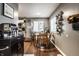 Cozy dining area adjacent to the kitchen, perfect for Gathering meals, with lovely decor at 3867 Asbury St, Indianapolis, IN 46227