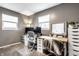 Functional home office featuring gray walls, two windows, a computer desk and ample storage at 3867 Asbury St, Indianapolis, IN 46227