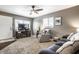Comfortable living room features plush seating, a ceiling fan, and a cozy atmosphere with lots of room at 3867 Asbury St, Indianapolis, IN 46227