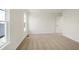 Bright bedroom with neutral carpet, a window, and a door leading to other rooms at 3923 Wren Dr, Brownsburg, IN 46112