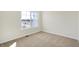 Cozy bedroom featuring a large window for ample natural light and carpet flooring at 3923 Wren Dr, Brownsburg, IN 46112