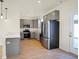 Contemporary kitchen with gray cabinets, stainless steel appliances, and an open layout for easy entertaining at 3923 Wren Dr, Brownsburg, IN 46112